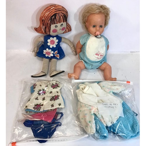 14 - Tiny Tears doll with closing eyes and a selection of various clothing along with a rag doll and some... 