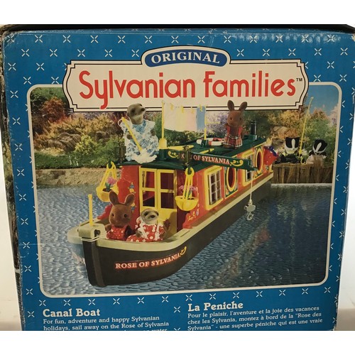 13 - Sylvanian Families Canal Boat found here boxed and in VG+ condition with a set of otter family membe... 