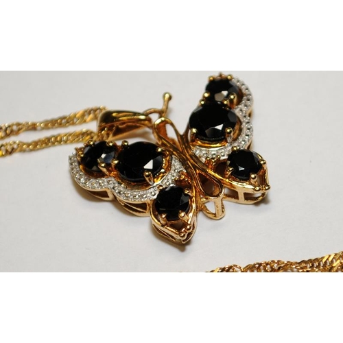 541 - Large black sapphire 18ct gold on silver butterfly pendant