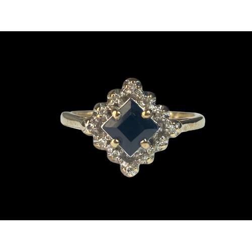 411 - A 9ct Gold Ladies Diamond & Sapphire Cluster Ring. 3.1g. Size N