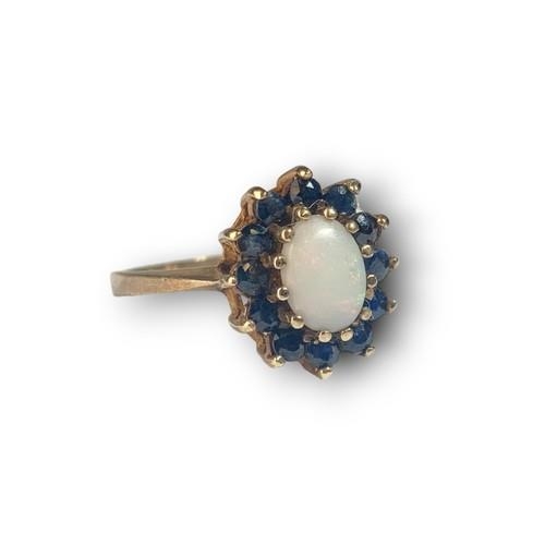 463 - 9ct gold ladiesSapphire and Opal cluster ring size O