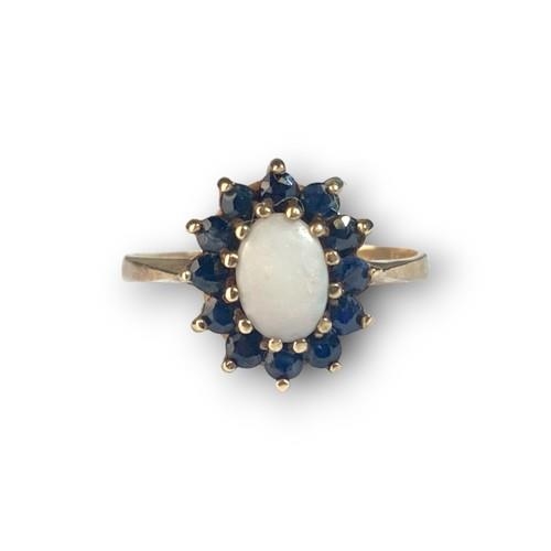 463 - 9ct gold ladiesSapphire and Opal cluster ring size O