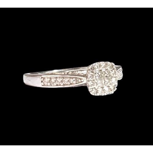 501 - A 9ct White Gold Ladies Diamond Ring. Square Shaped with Diamonds to the Shank. Size M