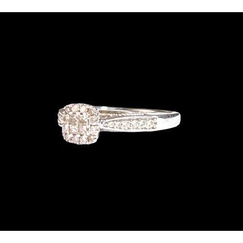 501 - A 9ct White Gold Ladies Diamond Ring. Square Shaped with Diamonds to the Shank. Size M