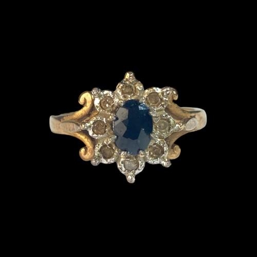 533 - A 9ct Gold Ladies Diamond & Sapphire Cluster Ring. H/M Dia in ring. Size M