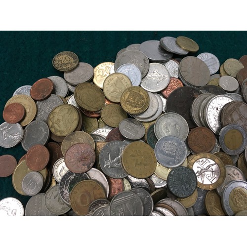 270 - A white tub of foreign coinage.