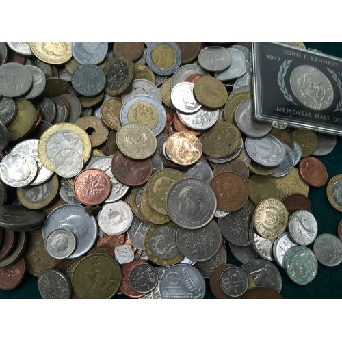 270 - A white tub of foreign coinage.