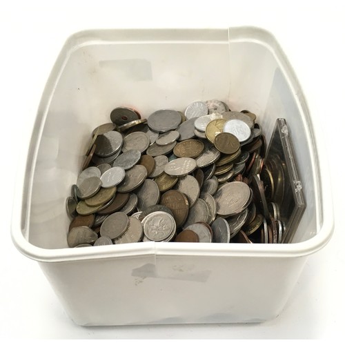 270 - A white tub of foreign coinage.