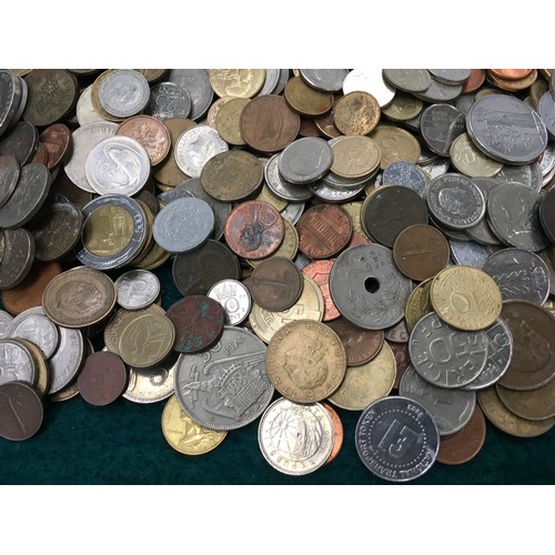 271 - A brown box of foreign coinage.