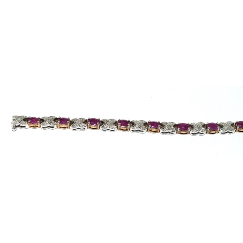 439 - A 9ct Gold Diamond & Ruby Line Bracelet. H/M to box clasp. Approx 0.85ct Diamond 7g. 7 inches in len... 