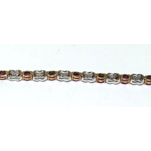 439 - A 9ct Gold Diamond & Ruby Line Bracelet. H/M to box clasp. Approx 0.85ct Diamond 7g. 7 inches in len... 