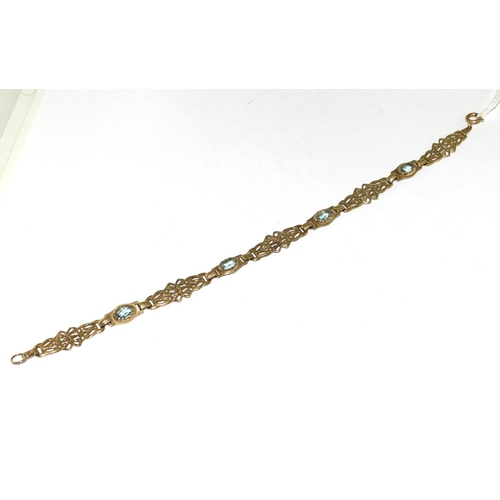 504 - A 9ct Gold Ladies Fancy Link Aquamarine Bracelet. Weight - 6g