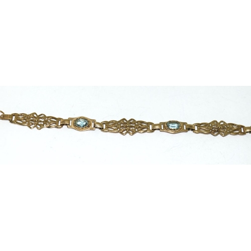 504 - A 9ct Gold Ladies Fancy Link Aquamarine Bracelet. Weight - 6g