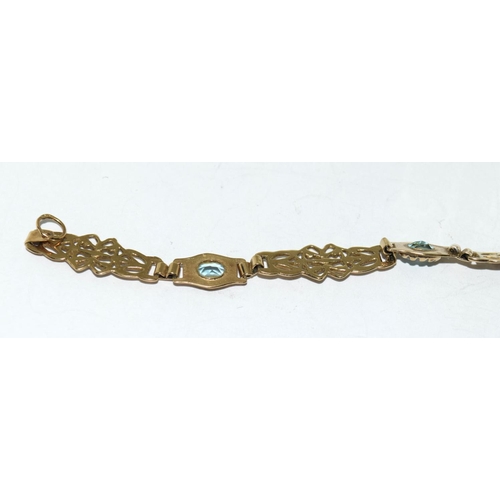 504 - A 9ct Gold Ladies Fancy Link Aquamarine Bracelet. Weight - 6g