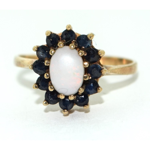 463 - 9ct gold ladiesSapphire and Opal cluster ring size O