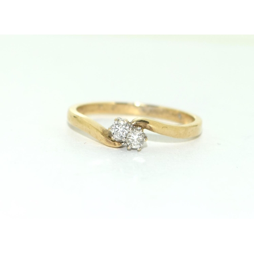 458 - A 9ct Gold Ladies Cross Over Ring, Set with 2 Brilliant Cut Diamonds. Size O