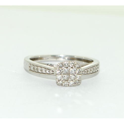 501 - A 9ct White Gold Ladies Diamond Ring. Square Shaped with Diamonds to the Shank. Size M