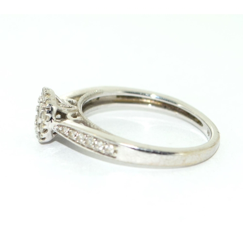 501 - A 9ct White Gold Ladies Diamond Ring. Square Shaped with Diamonds to the Shank. Size M