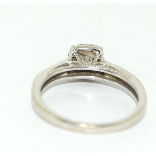 501 - A 9ct White Gold Ladies Diamond Ring. Square Shaped with Diamonds to the Shank. Size M