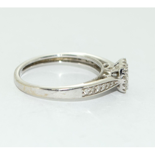 501 - A 9ct White Gold Ladies Diamond Ring. Square Shaped with Diamonds to the Shank. Size M