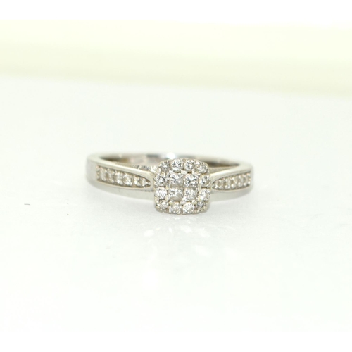 501 - A 9ct White Gold Ladies Diamond Ring. Square Shaped with Diamonds to the Shank. Size M