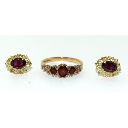 500 - A 9ct Gold Ladies Garnet Ring, Size N, together with Pair of Garnet Earrings.