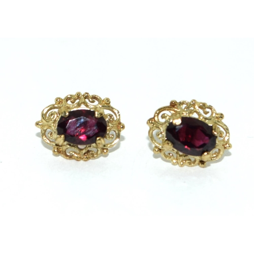 500 - A 9ct Gold Ladies Garnet Ring, Size N, together with Pair of Garnet Earrings.