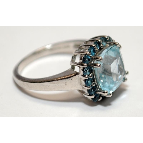 383 - A 925 silver and sky blue topaz ring, fully hallmarked, Size M 1/2.