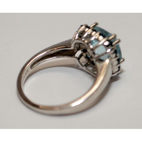 383 - A 925 silver and sky blue topaz ring, fully hallmarked, Size M 1/2.