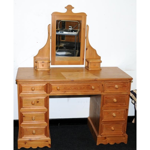 463 - Solid pine kneehole dressing table with a total of nine drawers c/w dressing table mirror with an ad... 