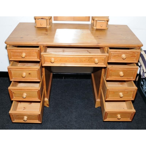 463 - Solid pine kneehole dressing table with a total of nine drawers c/w dressing table mirror with an ad... 