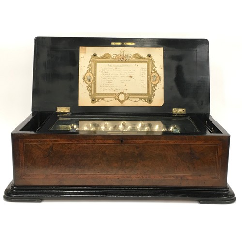 209 - Superb quality antique inlaid mahogany music box. 12 melodies. Features 7 bells. In good working ord... 