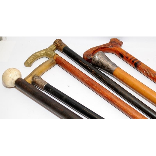 206 - Two vintage walking sticks with duck and dog head finials c/w two vintage umbrellas, one with a duck... 