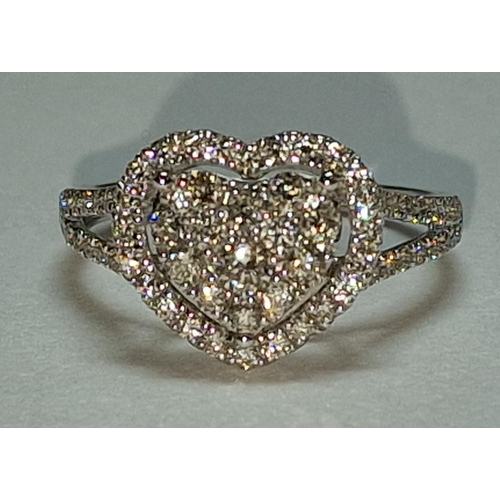 505 - A 9ct white gold and diamond heart shaped ring Size M 1/2.