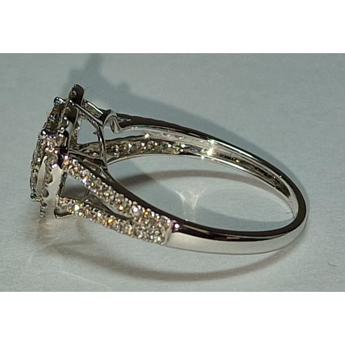 505 - A 9ct white gold and diamond heart shaped ring Size M 1/2.