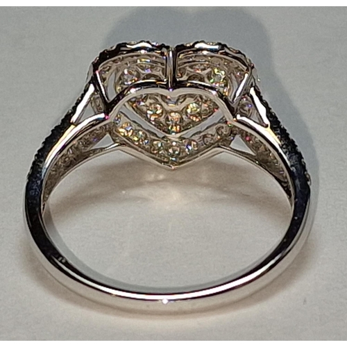 505 - A 9ct white gold and diamond heart shaped ring Size M 1/2.