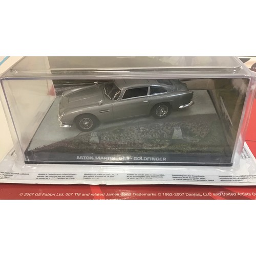 53 - James Bond No.1 Diecast Model plus sealed Tomb Raider motorcycle gear. The James Bond Car Collection... 