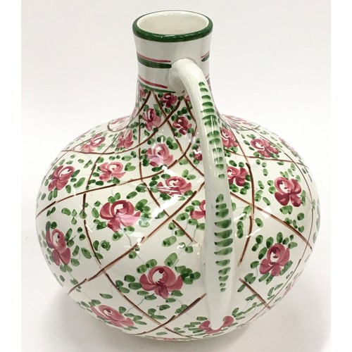 218 - Wemyss style pottery hand painted twin handled vase painted with roses. Impressed numbers to base 27... 