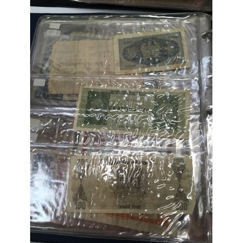 219 - 240+ banknotes in two albums (Blue & Black).