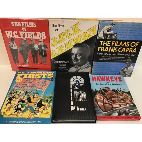 80 - 2 boxes containing a quantity of soft and hardback books relating to comics, film stars and comic he... 