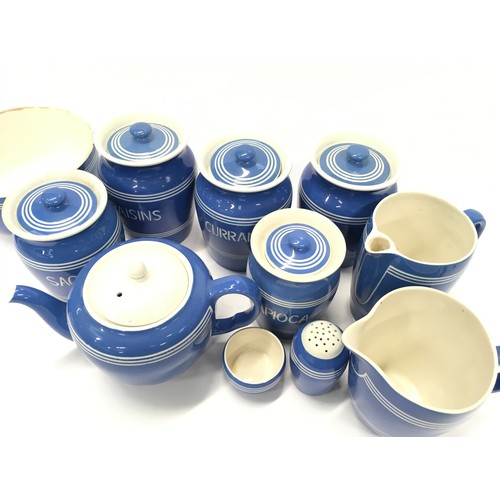 234 - Collection of blue and white Bretby Pottery to include storage jars. 11 pieces in total.