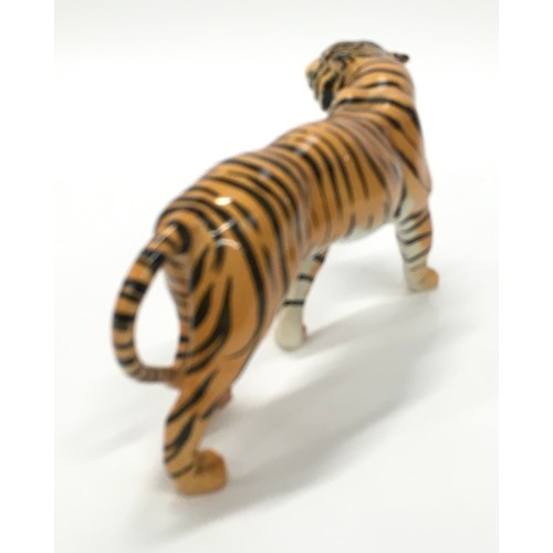 306 - Beswick tigress ornament with markings 23cm long.