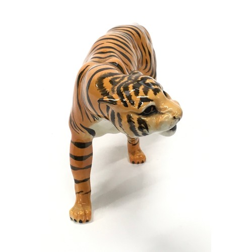 306 - Beswick tigress ornament with markings 23cm long.