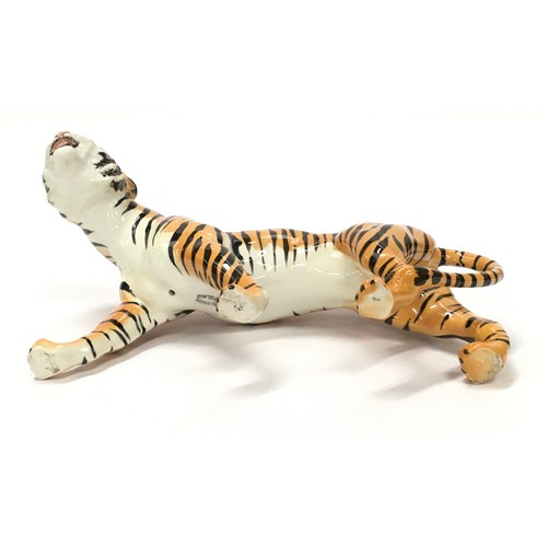 306 - Beswick tigress ornament with markings 23cm long.