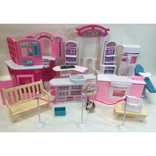 101 - A selection of various Barbie house furniture items to include seats - shop units - sink units etc. ... 