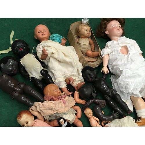 138 - Colection of vintage composition dolls and some parts.