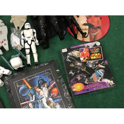 155 - Large collection of Star Wars merchandise to include figurines, lego and other pieces.