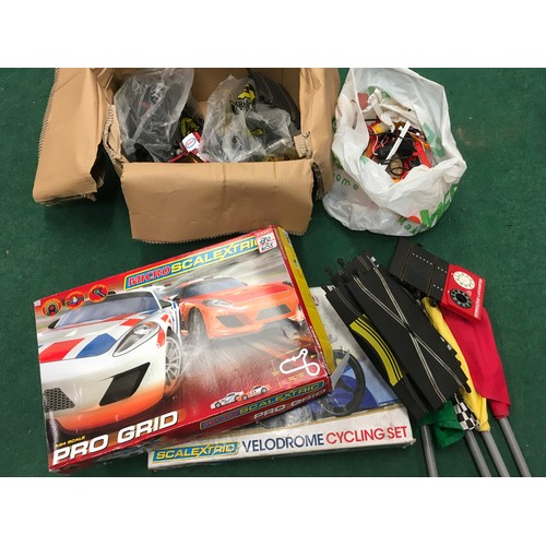 160 - Two Scalextric sets together with a large box containing track, remotes, cars and other Scalextric a... 