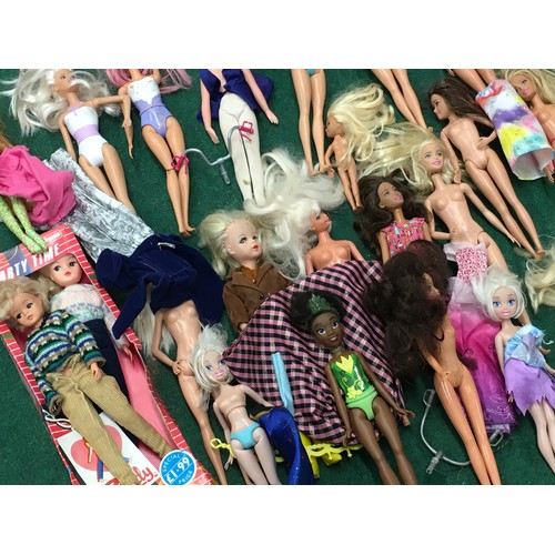 164 - Box containing a large collection of Barbie, Sindy and other dolls.