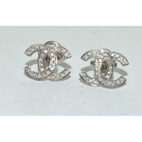 502 - 18ct white gold Chanel style earrings.